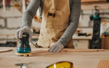 Photo of someone using a hire sander on a weekend project.